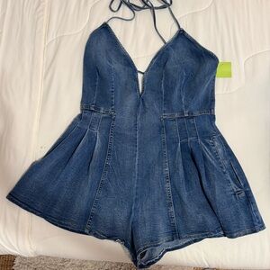 Jean romper, short and backless. New with tags. Size Large